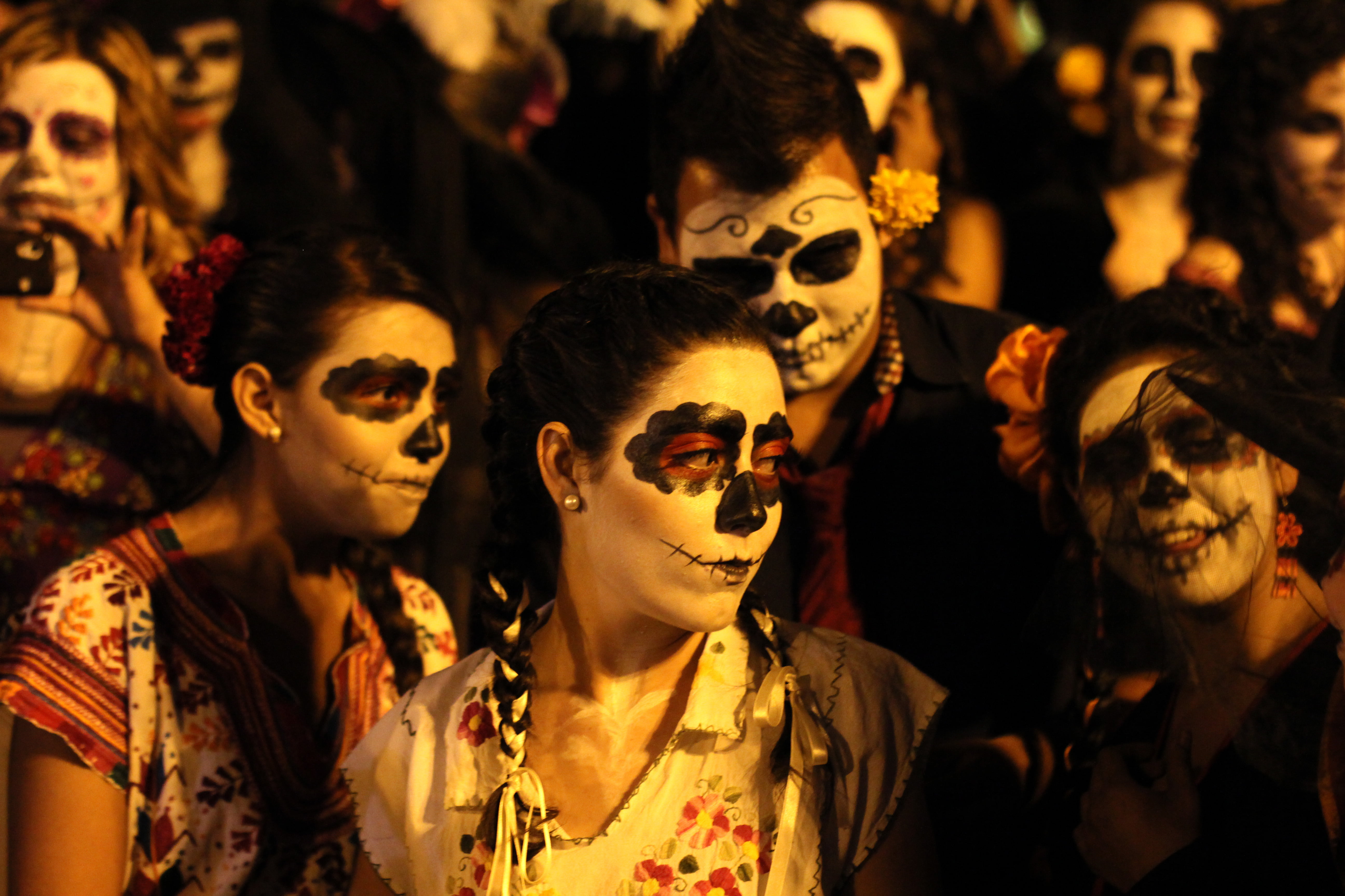 People disguised as "Catrina" during the celebration of the day of dead in Guadalajara, Mexico on November 02, 2012. La catrina is the Mexican representation of death and this year celebrates 100 years of having been created by the Mexican artist Jose Guadalupe Posada. AFP PHOTO/Hector Guerrero (Photo credit should read HECTOR GUERRERO/AFP/Getty Images)